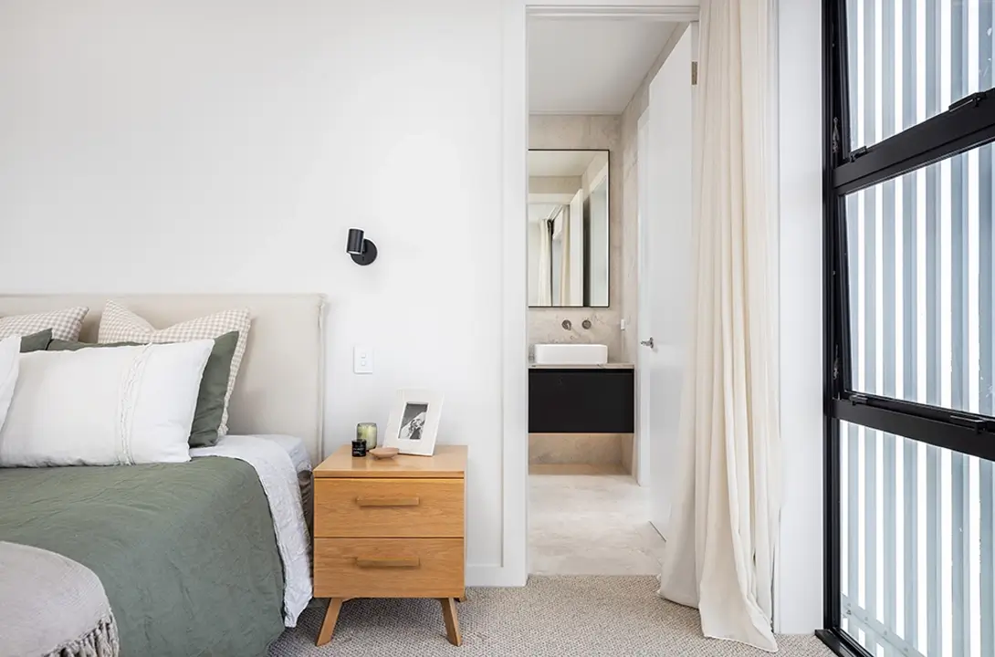 Half shot of a bed looking into the ensuite